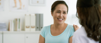 Woman speaks with doctor